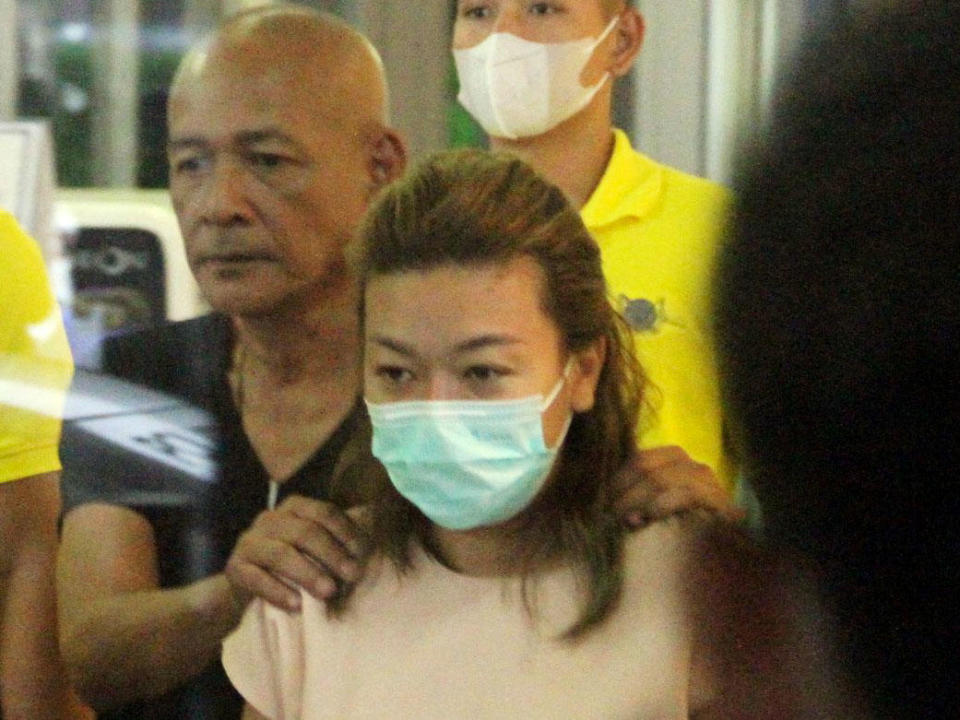 Sararat Rangsiwuthaporn is escorted by police officers in Bangkok, Thailand, April 26, 2023. / Credit: Daily News Handout via Reuters