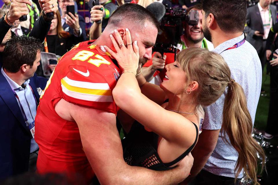 <p>Ezra Shaw/Getty</p> Travis Kelce and Taylor Swift embrace after the 2024 Super Bowl