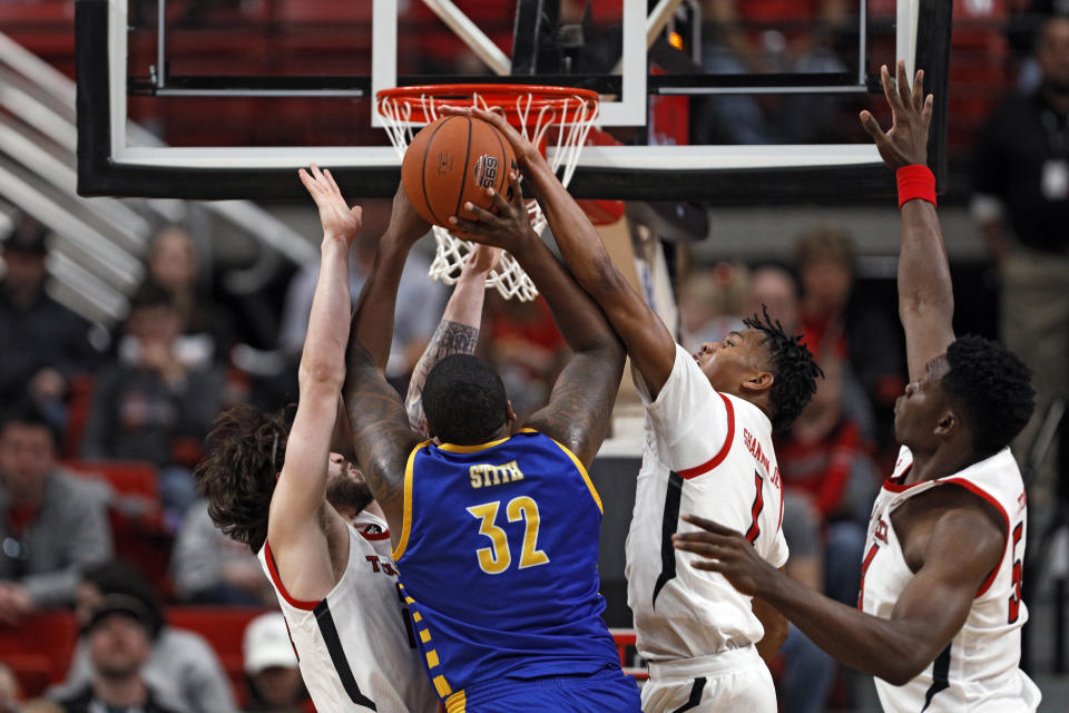 Texas Tech's Terrence Shannon Jr. (1) blocks Cal State Bakersfield's Shawn Stith (32) who shoots during the first half of an NCAA college basketball game Sunday, Dec. 29, 2019, in Lubbock, Texas. (AP Photo/Brad Tollefson)