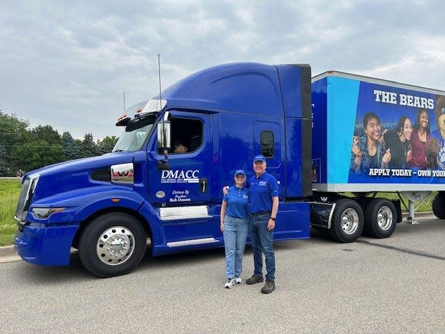 Rob Denson, president of Des Moines Area Community College, and his wife Pat with his latest Freightliner loaner semi.