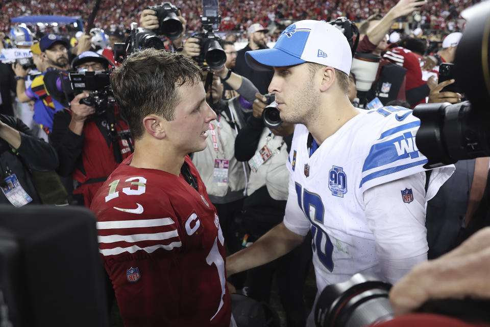 San Francisco 49ers quarterback Brock Purdy, left, talks with Detroit Lions quarterback Jared Goff after the NFC Championship NFL football game in Santa Clara, Calif., Sunday, Jan. 28, 2024. (AP Photo/Jed Jacobsohn)