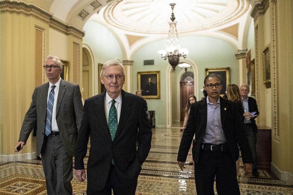 Senate Majority Leader Mitch McConnell of Ky., center, walks before the Republican policy luncheon on Capitol Hill, Wednesday, Oct. 10, 2018 in Washington. (AP Photo/Alex Brandon)