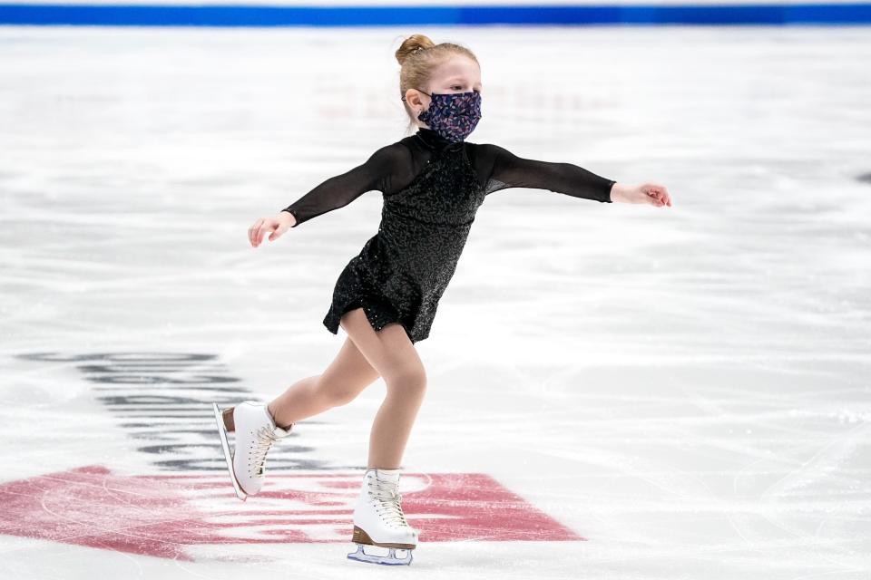 Five-year-old Ruby Briley, one of 64 sweepers from Nashville area, skates on the ice during the Championship Ladies Short Program event during the U.S. Figure Skating Championships at Bridgestone Arena in Nashville, Tenn., Thursday, Jan. 6, 2022.