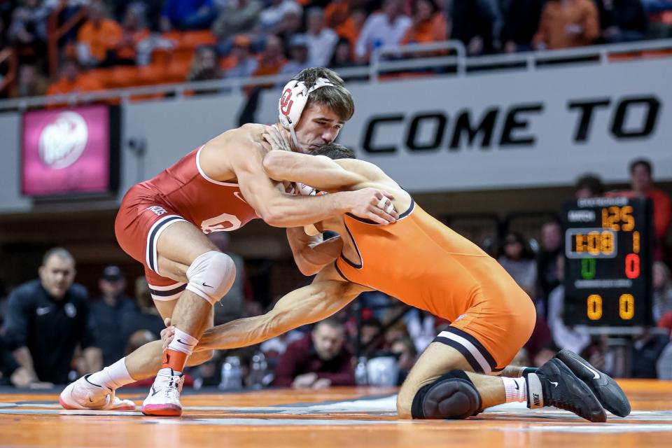 Oklahoma’s Joey Prata faces off against Oklahoma State’s Reece Witcraft during a college wrestling meet between the Oklahoma State Cowboys (OSU) and the Oklahoma Sooners at Gallagher-Iba Arena in Stillwater, Okla., Thursday, Feb. 16, 2023.