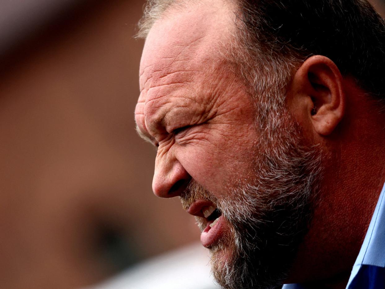 Infowars founder Alex Jones speaks to the media after appearing at his Sandy Hook defamation trial at Connecticut Superior Court in Waterbury, Connecticut