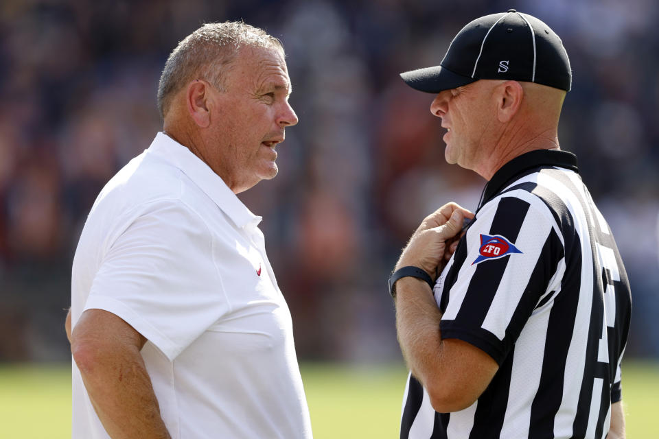 Arkansas head coach Sam Pittman talks with a referee during the first half of an NCAA college football game against Auburn, Saturday, Sept. 21, 2024, in Auburn, Ala.(AP Photo/Butch Dill)