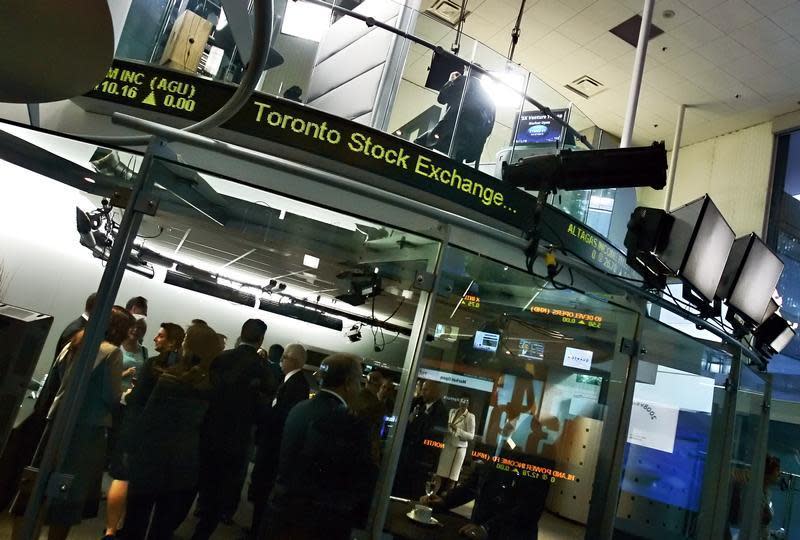 People attend a market open ceremony for the Toronto Stock Exchange at the TSX Broadcast Centre in Toronto June 20, 2008. REUTERS/Mark Blinch