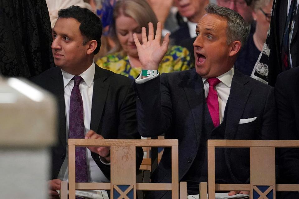 Scottish Labour leader Anas Sarwar, left, and leader of the Scottish Liberal Democrats Alex Cole-Hamilton, right, attend the National Service of Thanksgiving and Dedication for Britain&#x002019;s King Charles III and Queen Camilla (AP)