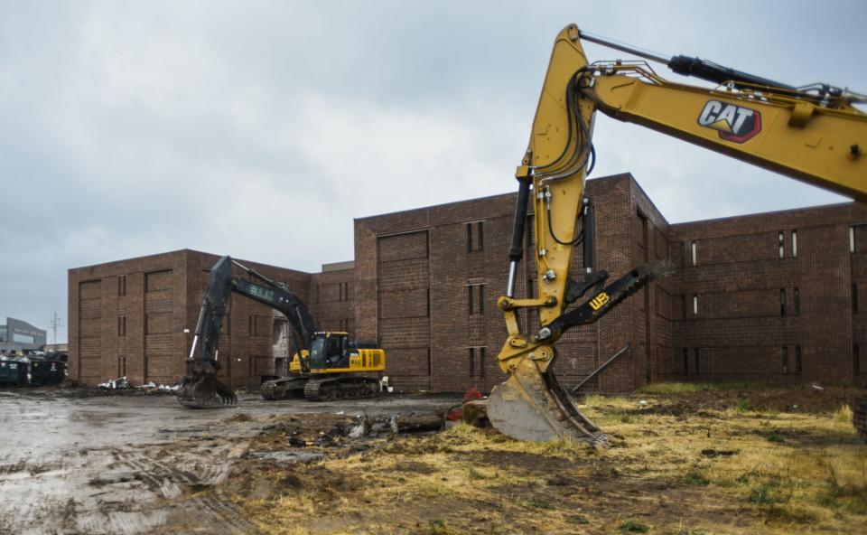 Demolition of the former Ingham County Jail, Sheriff's Department, and 55th District Court buildings seen in progress on Tuesday, June 27, 2023.