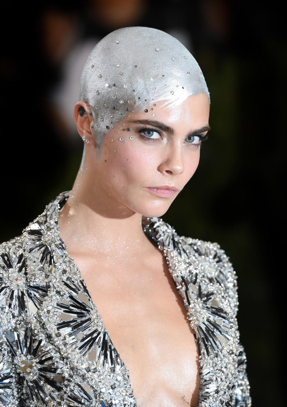 <p>Cara Delevingne once rocked a shining silver buzzcut, and this grown-out version is chic and sexy.(Photo: Getty Images) </p>