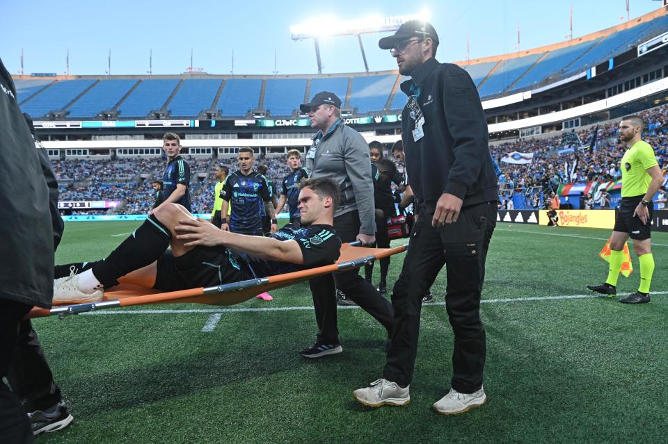 Apr 22, 2023; Charlotte, North Carolina, USA; Columbus Crew defender Will Sands (30) is carried off the field after suffering an apparent injury in the first half against Charlotte FC at Bank of America Stadium. Mandatory Credit: Griffin Zetterberg-USA TODAY Sports