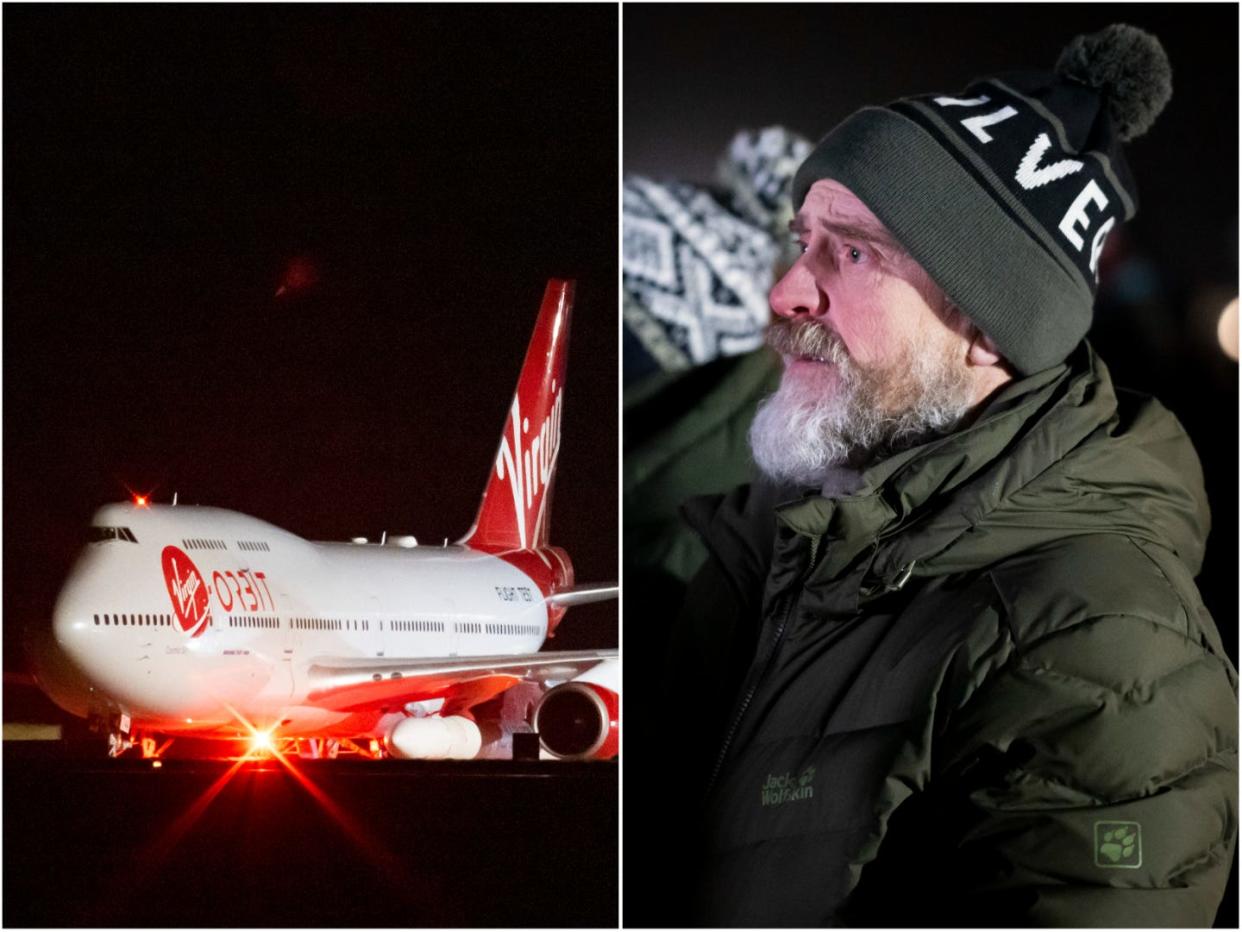 Spectators watch on a big screen at Cornwall Airport Newquay as the LauncherOne rocket is launched from Cosmic Girl, a Boeing 747-400, on January 9, 2023 in Newquay, United Kingdom.