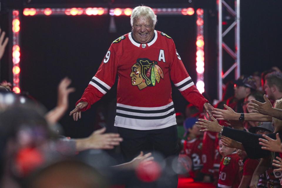 FILE - Former Chicago Blackhawks player Bobby Hull is introduced to fans during the NHL hockey team's convention in Chicago, July 26, 2019. Hull, a Hall of Fame forward who helped the Blackhawks win the 1961 Stanley Cup Final, has died. He was 84. The Blackhawks and the NHL Alumni Association announced the death of the two-time NHL MVP on Monday, Jan. 30, 2023. (AP Photo/Amr Alfiky, file)