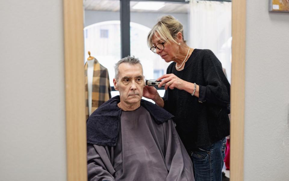 Resident Jean-Philippe Cougrand gets a trim at the village salon - Markel Redondo