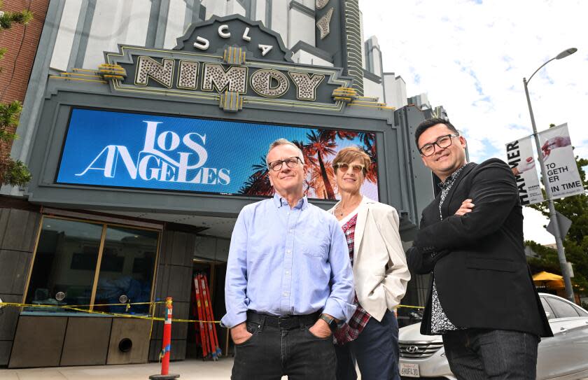Los Angeles, California August 10, 2023-From left, Fred Frumberg, Meryl Friedman and Edgar Miramontes stand in front of the Nimoy Theatre formerly the historic Crest Theatre. (Wally Skalij/Los Angles Times)