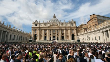 FILE PHOTO: The faithful gather in front of St. Peter's Basilica as Pope Francis conducts a prayer service in Saint Peter's Square at the Vatican, September 17, 2017. REUTERS/Stefano Rellandini/File Photo