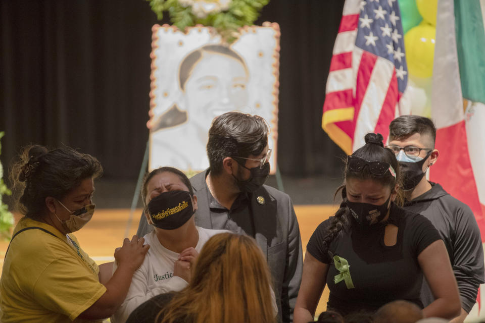 A family member of Army Spc. Vanessa Guillen, her Aunt Alma Garcia, second from left, becomes emotional at the public memorial service for Guillen on Friday, Aug. 14, 2020, in Houston. Guillen, who was last seen on April 22, was laid to rest nearly four months after she is said to have been killed by a fellow soldier at Fort Hood, a U.S. Army base in Texas. (Marie D. De Jesus/Houston Chronicle via AP, Pool)