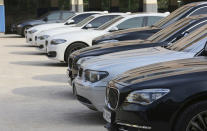 BMW cars are parked for emergency safety check up at the playground of an elementary school near a BMW service center in Seoul, South Korea, Tuesday, Aug. 14, 2018. South Korea will ban driving recalled BMWs that haven't received safety checks following dozens of fires the German automaker has blamed on a faulty exhaust gas component. (AP Photo/Ahn Young-joon)