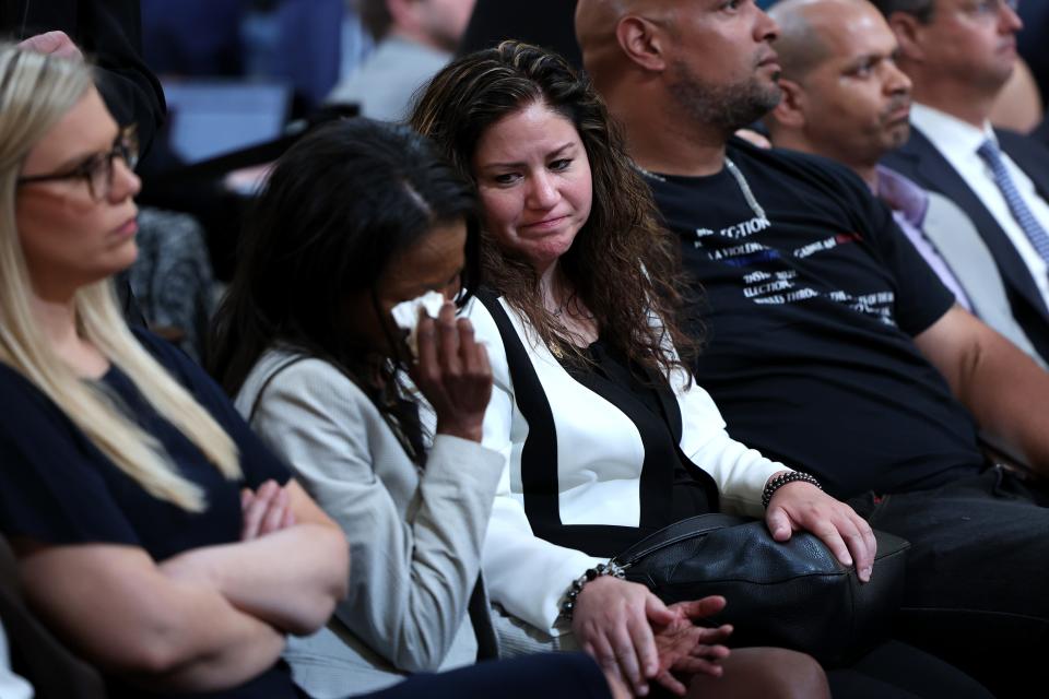 Sandra Garza, the long-time partner of Capitol Hill Police Officer Brian Sicknick who died shortly after the January 6 riot, comforts an audience member during a hearing held by the Select Committee to Investigate the January 6th Attack on the U.S. Capitol on June 9, 2022 in Washington, DC. The bipartisan committee, which has been gathering evidence related to the January 6 attack at the U.S. Capitol for almost a year, will present its findings in a series of televised hearings. On January 6, 2021, supporters of President Donald Trump attacked the U.S. Capitol Building during an attempt to disrupt a congressional vote to confirm the electoral college win for Joe Biden.