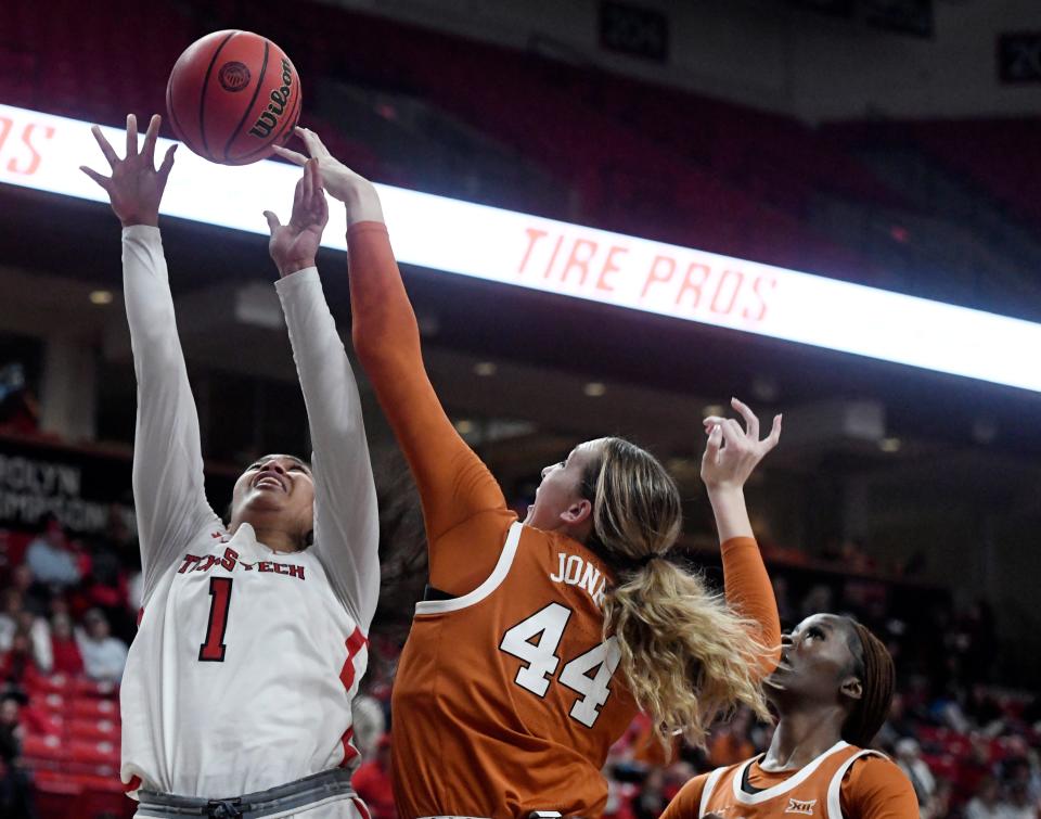 Texas Tech's center Ella Tofaeono (1), left, and Texas' forward Taylor Jones (44) reach for the rebound in a Big 12 women's basketball game, Wednesday, Jan. 18, 2023, at United Supermarkets Arena.