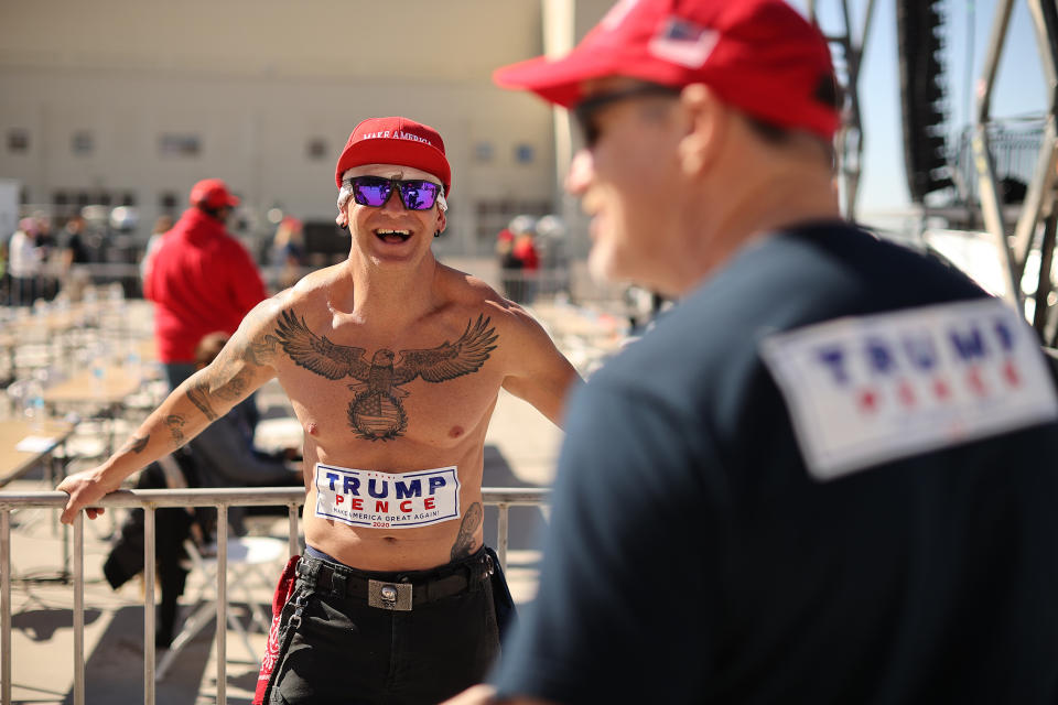 GOODYEAR, ARIZONA - OCTOBER 28:  Supporters of U.S. President Donald Trump waits in line to attend a campaign rally with Tru at Phoenix Goodyear Airport October 28, 2020 in Goodyear, Arizona. With less than a week until Election Day, Trump and his opponent, Democratic presidential nominee Joe Biden, are campaigning across the country. (Photo by Chip Somodevilla/Getty Images)