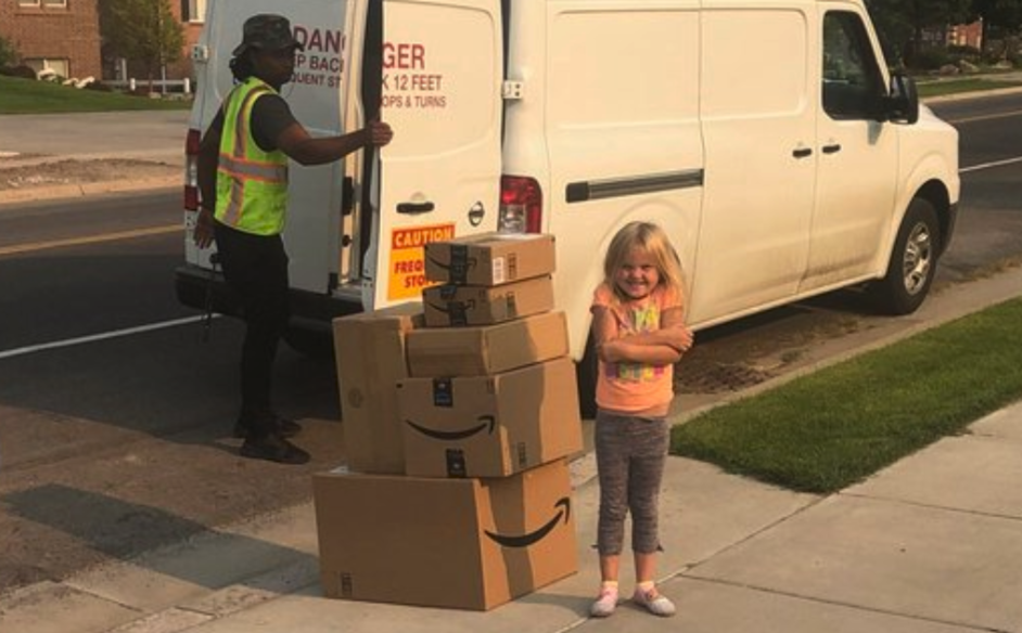 6-year-old Caitlin stands next to her haul of toys after her mother left her unattended with her Amazon account. (Photo: Ria Diyaolu via Twitter)