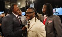 Alabama running back Trent Richardson, center, shakes hands with Alabama linebacker Dont'a Hightower, left, as Alabama cornerback Dre Kirkpatrick watches while waiting with other draft candidates before the first round of the NFL football draft at Radio City Music Hall, Thursday, April 26, 2012, in New York. (AP Photo/Jason DeCrow)