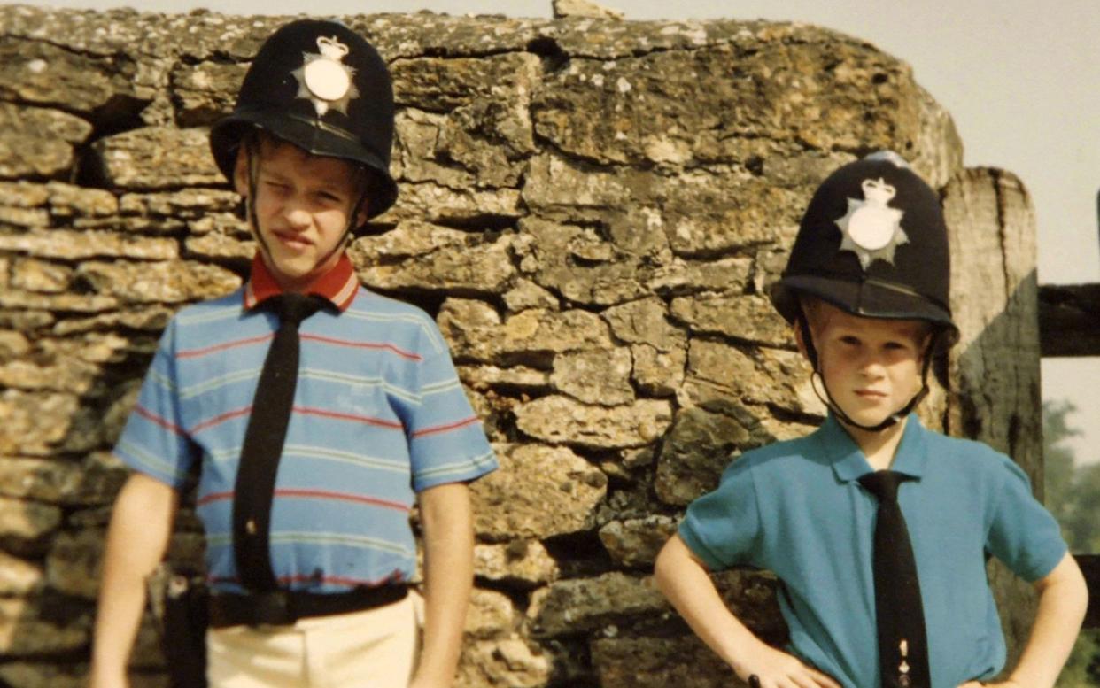 Prince William and Prince Harry in borrowed policemen outfits - PA