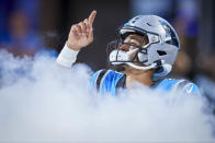 Carolina Panthers quarterback Bryce Young points to the sky as he takes the field prior to an NFL preseason football game against the Detroit Lions, Friday, Aug. 25, 2023, in Charlotte, N.C. (AP Photo/Brian Westerholt)