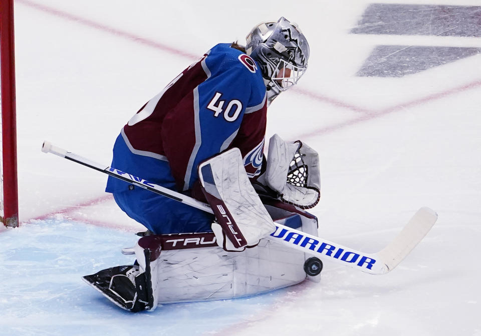 Colorado Avalanche goaltender Alexandar George blocks a Seattle Kraken shot during the first period in Game 1 of a first-round NHL hockey playoff series Tuesday, April 18, 2023, in Denver (AP Photo/Jack Dempsey)