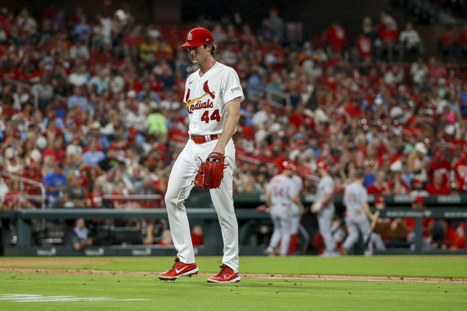 St. Louis Cardinals starting pitcher Jake Woodford walks to the dugout after being relieved from the mound during the second inning of a baseball game against the Cincinnati Reds, Friday, Sept. 29, 2023, in St. Louis. (AP Photo/Scott Kane)