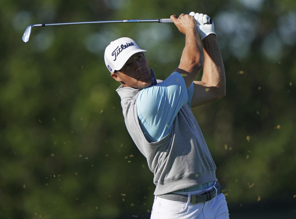 FILE - Garrett Rank plays his shot from the 10th tee during the first round of the U.S. Open Golf Championship, Thursday, June 14, 2018, in Southampton, N.Y. As recently as this past spring, Rank was pulled off the course five holes into a U.S. Open qualifier to serve as the standby official for Game 1 of the NHL hockey second-round series between Colorado and St. Louis. (AP Photo/Carolyn Kaster, File)