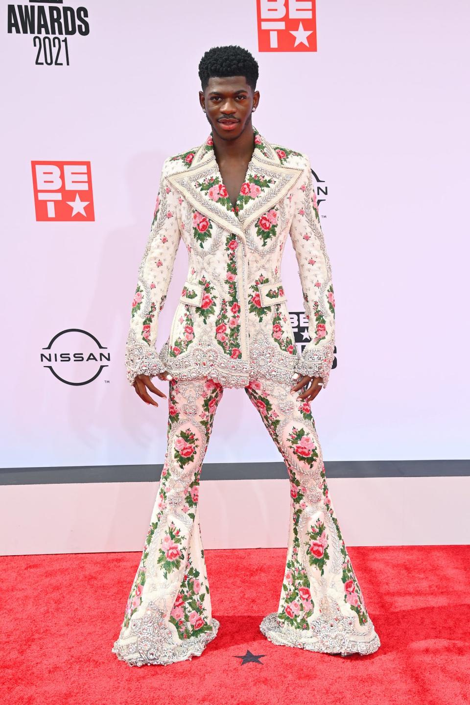 Lil Nas X wears a flared, floral-print suit at the 2021 BET Awards.