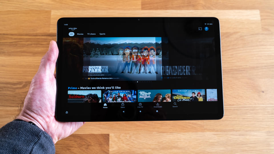 Screen showing entertainment on an Amazon Fire Max 11 tablet in a wooden surface