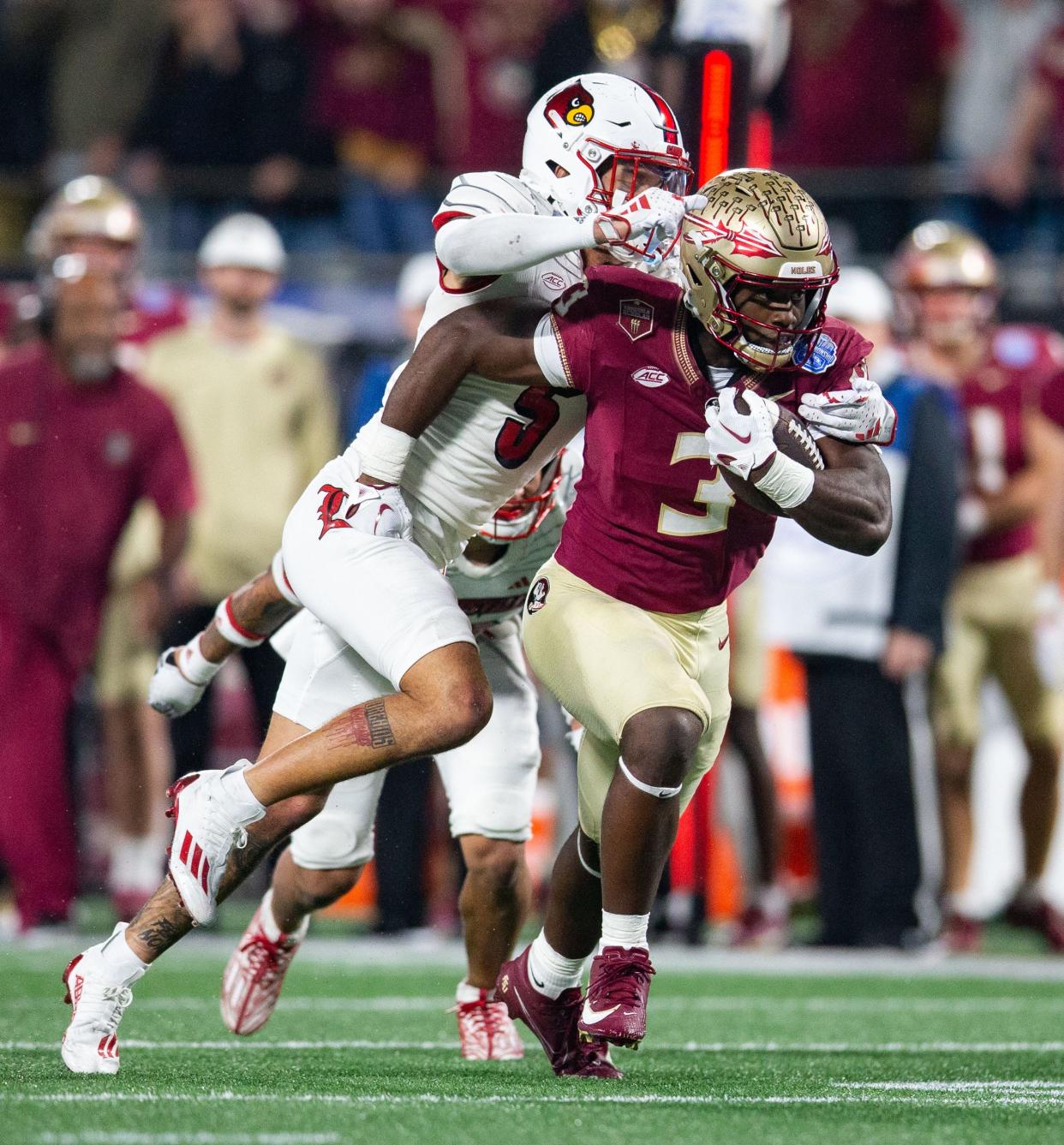 Florida State Seminoles running back Trey Benson (3) makes his way down the field. The Florida State Seminoles defeated the Louisville Cardinals 16-6 to claim the ACC Championship title in Charlotte, North Carolina on Saturday, Dec. 2, 2023.