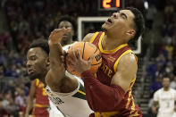 Baylor guard LJ Cryer, left, tries to steal the ball from Iowa State guard Tamin Lipsey during the first half of an NCAA college basketball game in the second round of the Big 12 Conference Tournament Thursday, March 9, 2023, in Kansas City, Mo. (AP Photo/Charlie Riedel)