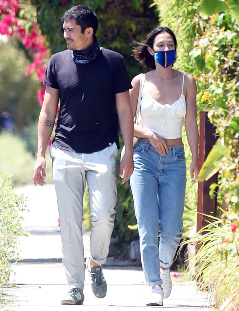 <p>Henry Golding and wife Liv Lo get some exercise in their Los Angeles neighborhood on Tuesday.</p>