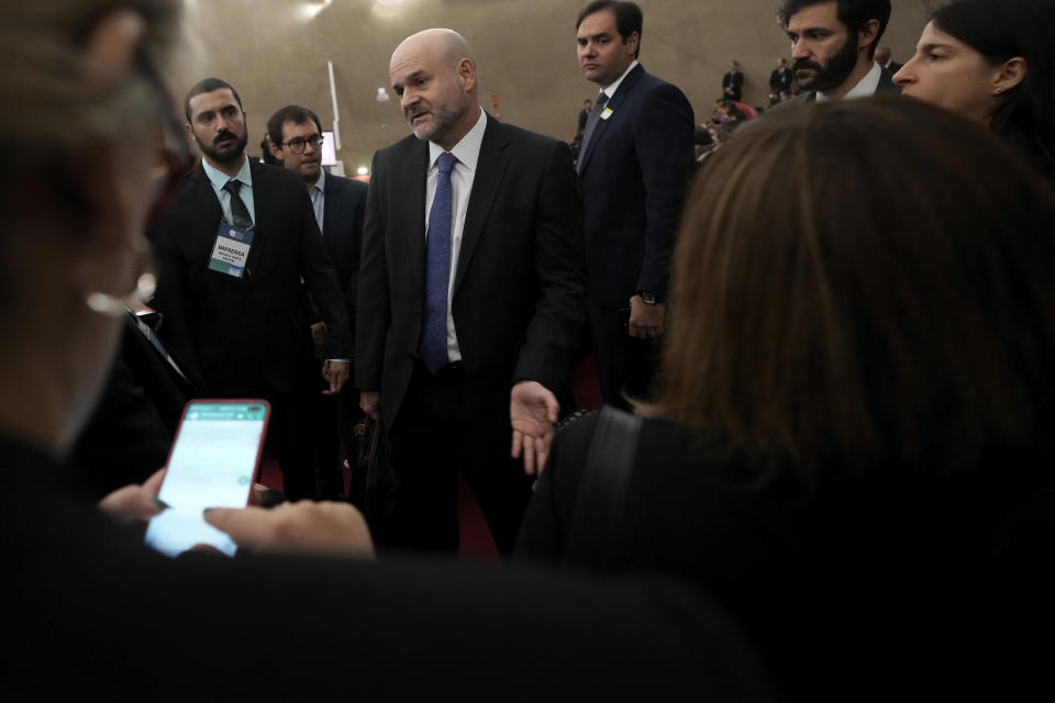 Tarcisio Vieira de Carvalho, defense lawyer for former President Jair Bolsonaro, talks with journalists before the start of Bolsonaro's trial at the Supreme Court in Brasilia, Brazil, Thursday, June 22, 2023. Judges are evaluating the case which claims the leader abused his power by using government communication channels to promote his campaign and cast unfounded doubts on the country’s electronic voting system. (AP Photo/Eraldo Peres)