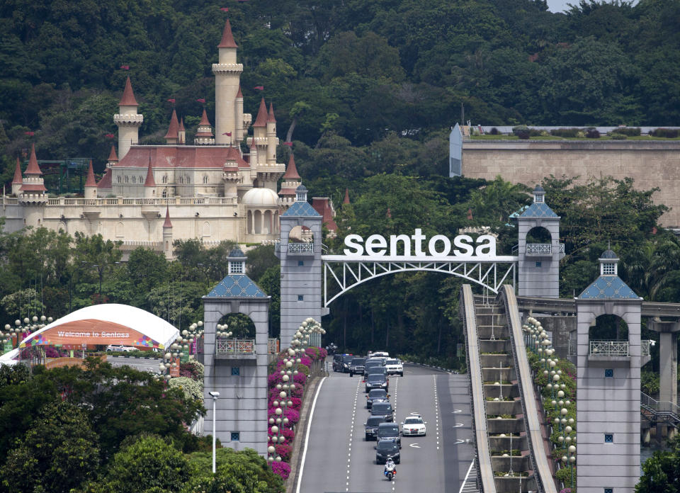 <p>Seen from the Bay Hotel in Singapore, a motorcade carrying North Korean leader Kim Jong Un leaves Sentosa Island where the summit between him and President Donald Trump took place at the Capella Hotel Tuesday, June 12, 2018, in Sentosa, Singapore. (Photo: Gemunu Amarasinghe/AP) </p>