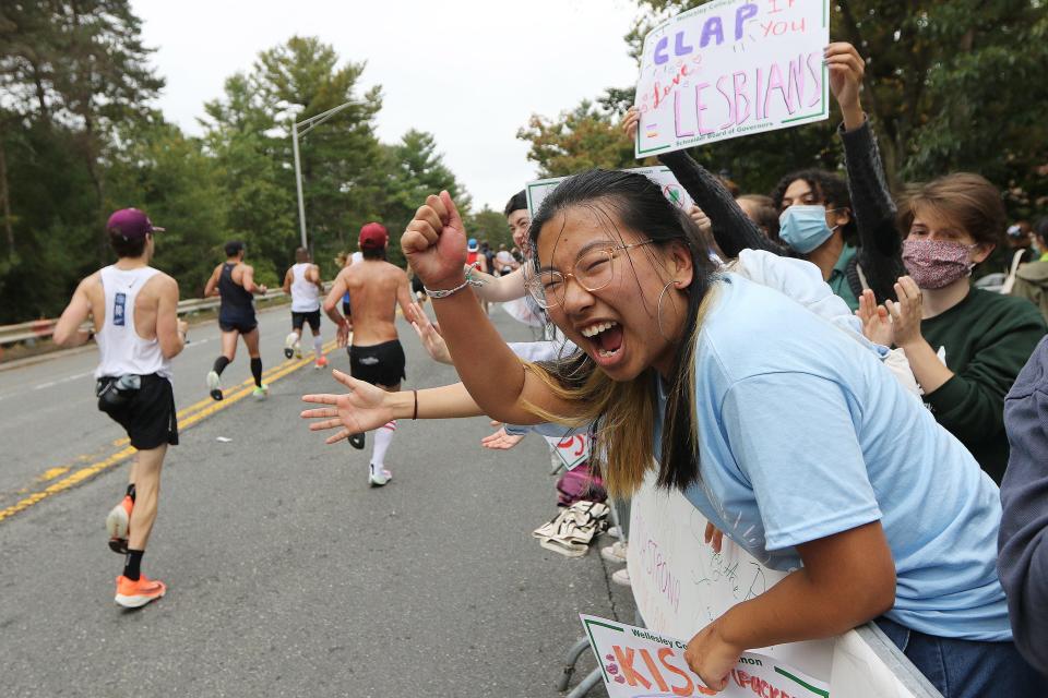 Wellesley College student Sophia Fiazhang, of California, added her voice to the Scream Tunnel made up of the school's students during the running of the 125th Boston Marathon, Oct. 11, 2021.