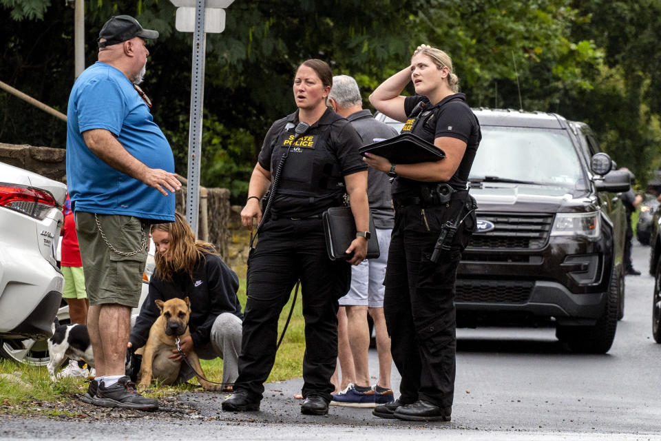 PA State Troopers and other law enforcement officers are on the scene in Nantmeal Village as the search for escaped convict Danelo Cavalcante moved to northern Chester County Sunday, Sept. 10, 2023. (Tom Gralish/The Philadelphia Inquirer via AP)