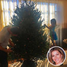 <p>Gisele Bündchen posted a photo of her Patriots quarterback hubby, Tom Brady, decking the halls with their 4-year-old daughter, Vivian Lake, who was sporting some angel wings for the occasion. </p>