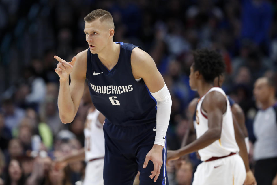 Dallas Mavericks forward Kristaps Porzingis (6) celebrates sinking a three-point basket in the second half of an NBA basketball game against the Cleveland Cavaliers in Dallas, Friday, Nov. 22, 2019. (AP Photo/Tony Gutierrez)