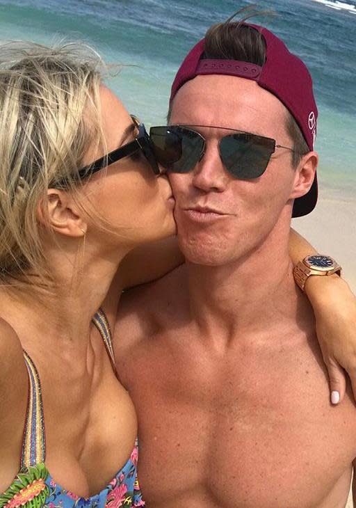 Roxy and Oliver look loved-up as she flashes engagement ring