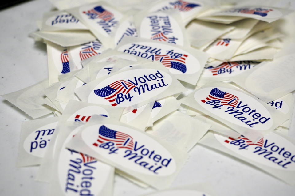 Stickers sit inside the Wayne County Board of Elections office on Thursday, Sept. 22, 2022, in Goldsboro, N.C. (AP Photo/Hannah Schoenbaum)