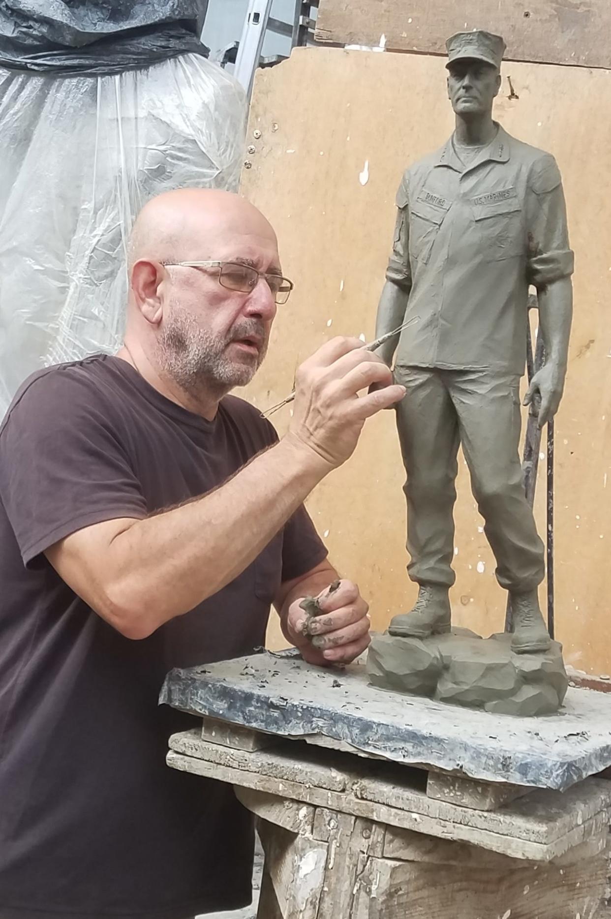Sculptor Sergey Eylanbekov works on a clay model of Gen. Joseph Dunford at his studio in Pietrasanta, Italy.