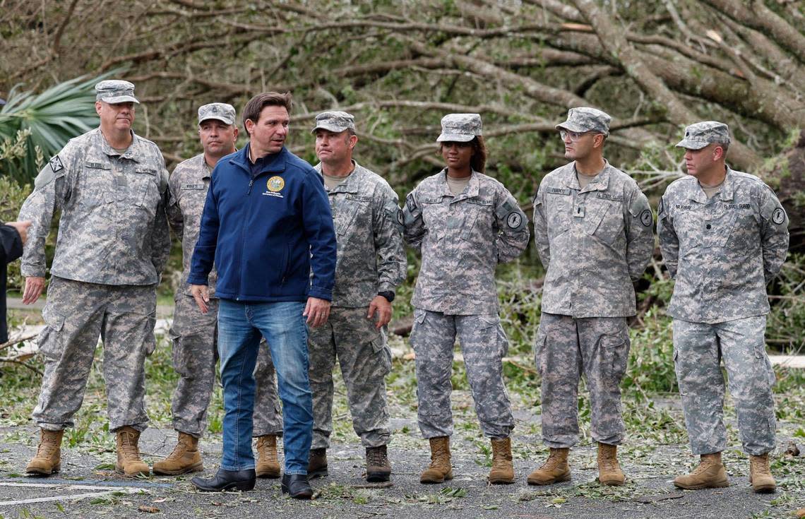 Florida Gov. Ron DeSantis stands with the Florida State Guard after speaking to reporters about the impact of Hurricane Idalia on Florida’s West Coast during a press conference in Perry, Florida on Wednesday, August 30, 2023.