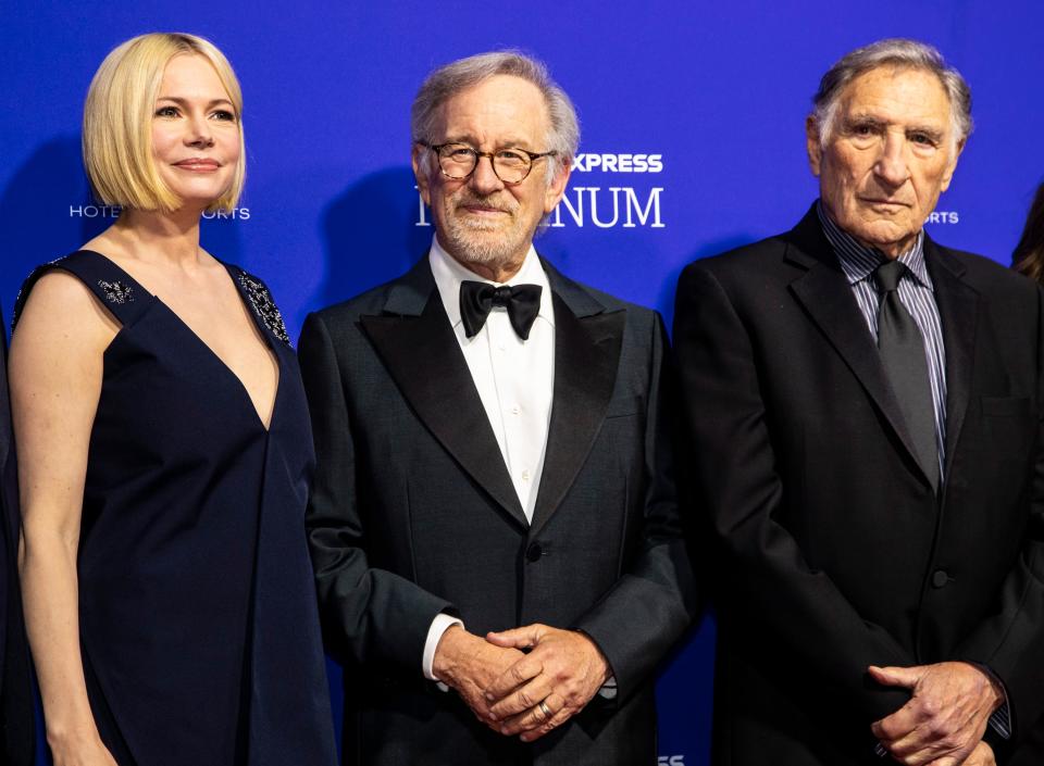 Director Steven Spielberg poses with actress Michelle Williams and actor Judd Hirsch of "The Fabelmans" on the red carpet at the Palm Springs International Film Awards in Palm Springs, Calif., Thursday, Jan. 5, 2023.