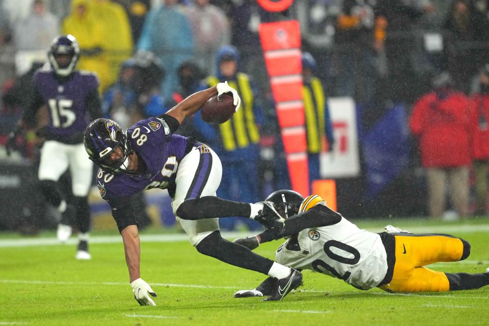 Jan 6, 2024; Baltimore, Maryland, USA; Baltimore Ravens tight end Isaiah Likely (80) runs for a second quarter touchdown after his catch defended by Pittsburgh Steelers cornerback Patrick Peterson (20) at M&T Bank Stadium. Mandatory Credit: Mitch Stringer-USA TODAY Sports