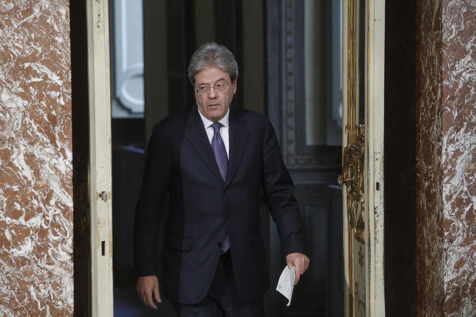 Italian Premier Paolo Gentiloni arrives for a press conference on the killing in Italy of suspected attacker at the Berlin Christmas market, during a press conference at Chigi Palace in Rome, Italy, Friday, Dec. 23, 2016. Gentiloni said Friday that he had called German Chancellor Angela Merkel to inform her that the man suspected of Monday's terrorist attack in Berlin had been killed near Milan. (Giuseppe Lami/ANSA via AP)
